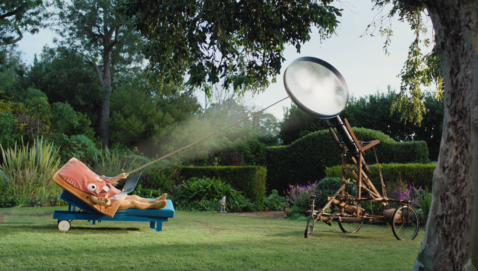 A Pop-Tart character laying on a lounge chair in the sun.